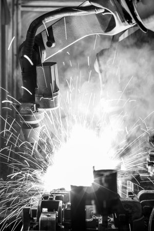 Welding robots movement auto parts in a car factoryの写真素材