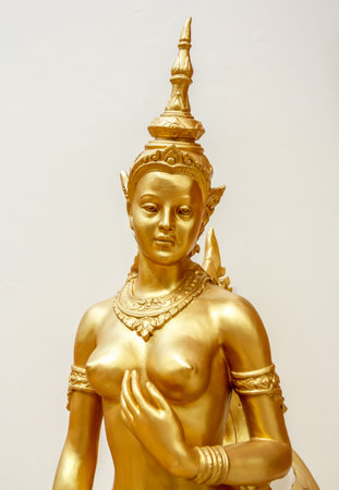 Kinnaree golden statue beautiful of white background in wat thailandの写真素材