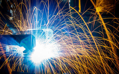 Welding robots movement in a car factoryの写真素材