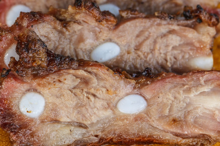 Beef steak cooked to medium rare on wooden backgroundの写真素材