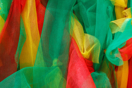 Multicolor Fabric texture tied to tree of local faith people in Thailand.の写真素材