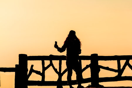 Silhouette people of a happy in new morning day.の写真素材