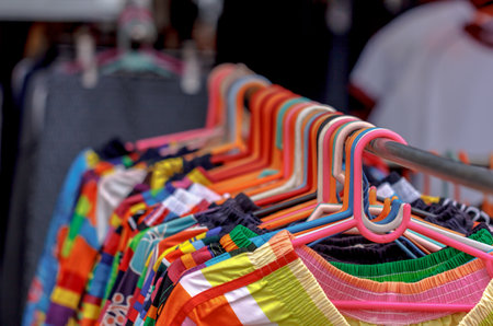 Hanger fabric shelves and t-shirts at a marketの写真素材