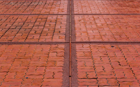 Sidewalk from red bricks concrete paver block floor pattern for background.
