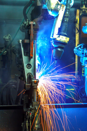 Welding robots movement in a car factory
