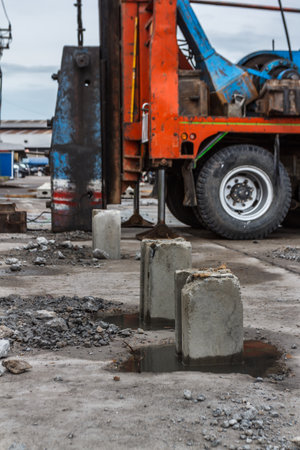 Construction site with pile-driver working.の写真素材