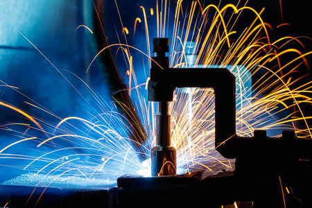 The arm of a welding robot moves with speed.の写真素材