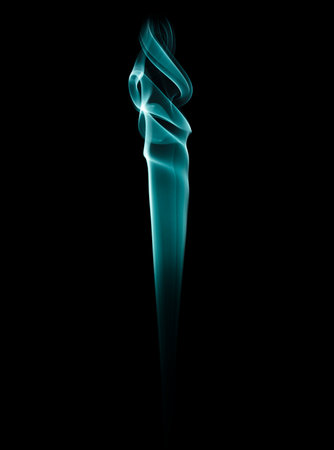 The smoke of incense stick are burning on the black background.の写真素材
