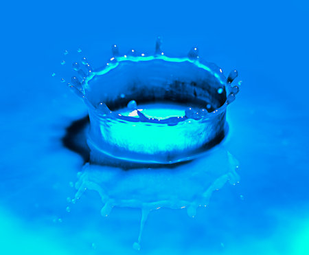 Color green drop in water, photographed in motion. Ink swirling in water.の写真素材