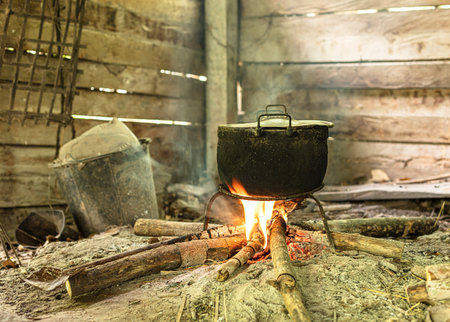Fire with old pots passed through cooking for a long time.の写真素材