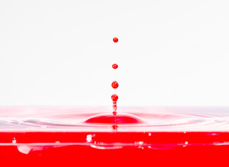 water drop reflected from the surface on which form circles beautifulの写真素材