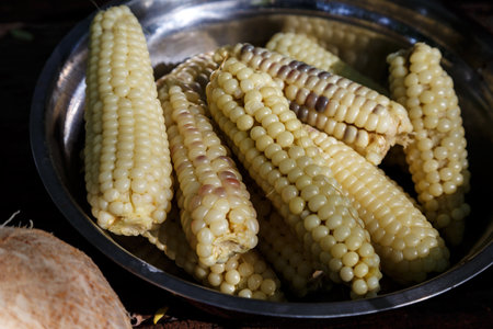 Boiled sweet corns in a bowl, ready to eatの写真素材
