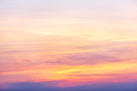Dramatic cloudy sky burst during sunsetの写真素材