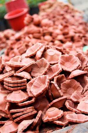 Vertical image of clay lamp (Diya) for sale at Market in india, diya decoration is part of Diwali...