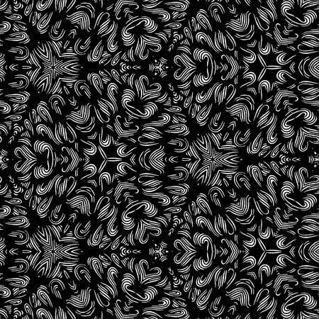 Beautiful and elegant monochromatic and grey symmetrical mandala designs on solid sheet of wallpaperの写真素材