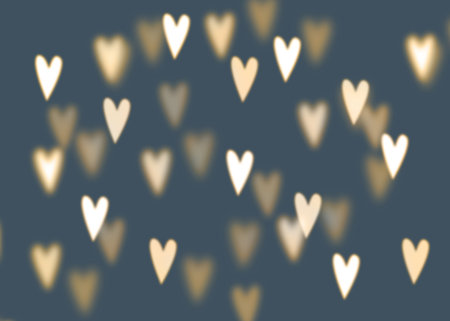 Abstract background with golden heart shaped bokeh lights, love conceptの写真素材