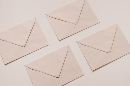 Set of blush pink blank envelopes mockups. Soft nude pastel background. Mailing, correspondence and...