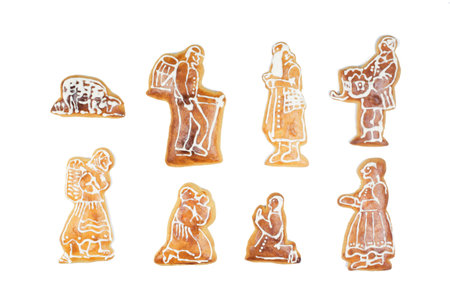 Handmade Christmas gingerbreas characters on a white backgroundの写真素材