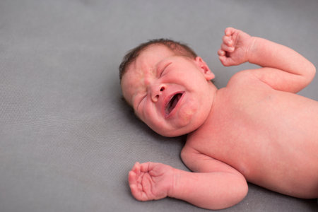 One week old newborn baby boy screamingの写真素材