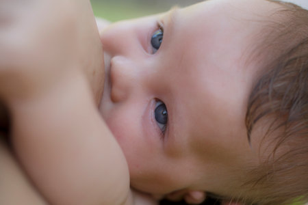 Mother breastfeeding her three months old boyの写真素材