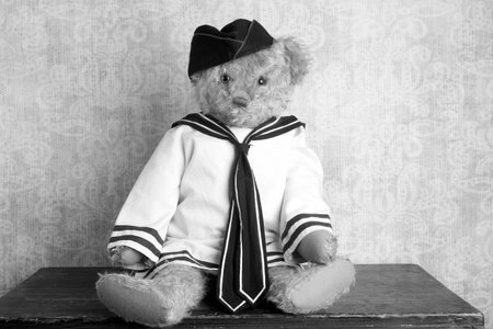 Vintage Teddy bear with a navy style clothing