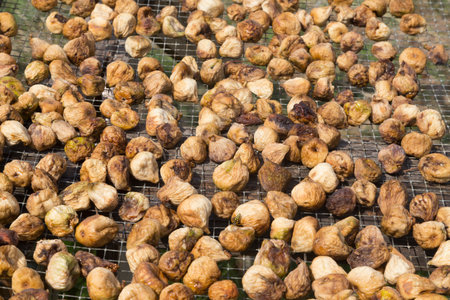 Dried figs on an small iron grating, dryingの写真素材