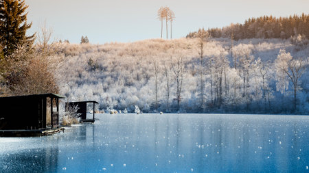 Frozen lake with blue ice, winter, snow, januaryの写真素材