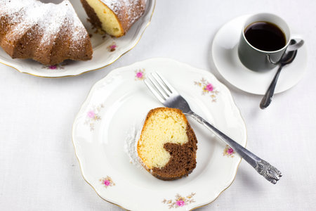 Fresh baked homemade marble cake with cup of coffeeの写真素材