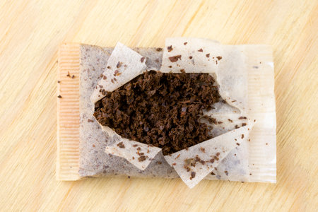 used tea bag on a wooden tableの写真素材