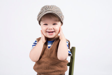 Smiling cute two years old boy, white backgroundの写真素材