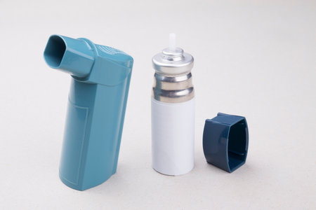 An asthma inhaler on a gray backgroundの写真素材