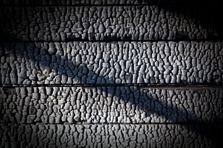 Charred wall, destroyed by fire wooden house, backgroundの写真素材