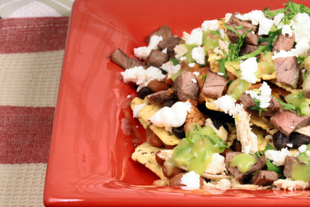 An exquisite organic mexican nachos with wheat corn tortilla and hormone free beef の写真素材