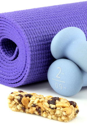 perfect losing weight combo for women, cereal bar with protein,fiber and good carbs plus a yoga mat  and  women dumbbell weights.  の写真素材