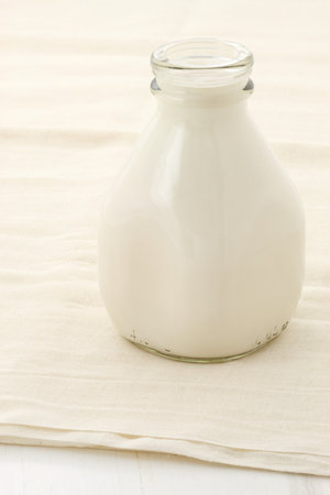 fresh, healthy soy milk on beautiful cheese cloth, nutritious and delicious milk substitute.の写真素材