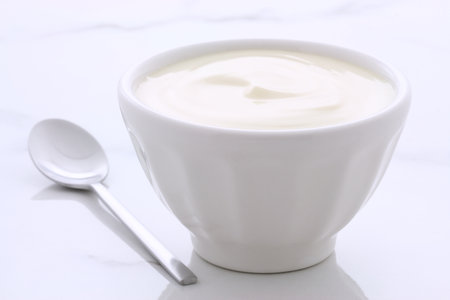 Delicious, nutritious and healthy fresh plain yogurt on vintage italian carrara marble setting.の写真素材
