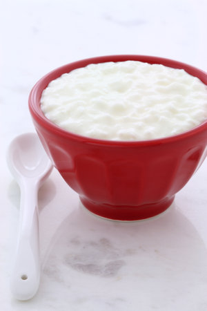 Delicious, nutritious and healthy fresh cottage cheese on vintage carrara marble setting.の写真素材