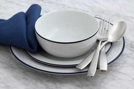 white porcelain dishes with classic blue borders an staple in Parisian bistros and brasseriesの写真素材