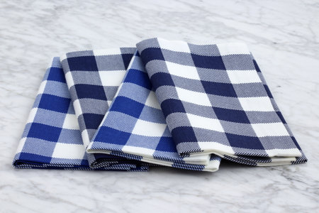 trendy and beautiful frabric placemats or napkins styled on antique carrara marbleの写真素材