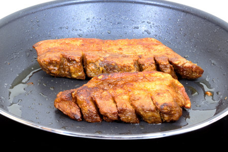 Homemade pork rinds or chicharrones carnudos in Spanish, easy to make in a kitchen pan. They are crunchy, meaty and delicious.の写真素材
