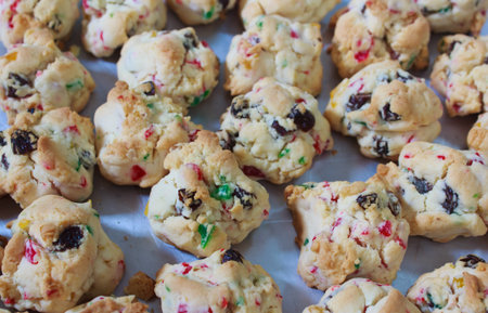 Cookies with dried cherry and raisin on tray.の写真素材