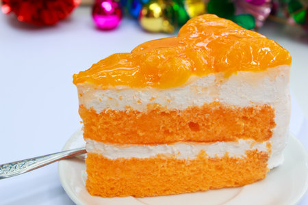 Orange cake on the white plate.の写真素材