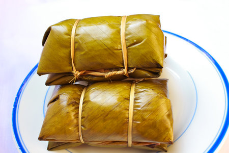 Thai sticky rice dessert wrapped in a Banana leaf の写真素材