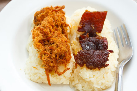 Sticky rice with sweet pork chop and fried meat, Thailand.の写真素材