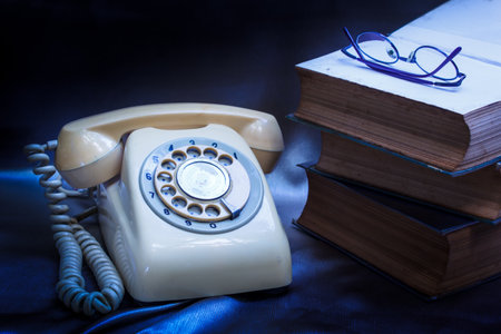 retro phone and book in vintage style.の写真素材