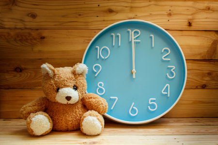 large clock blue face on wood background.