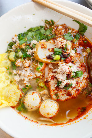 spicy lemongrass flavored flat noodles with pork, thai style.の写真素材