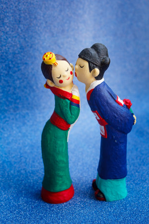couple doll on blue background, valentine's day.の写真素材