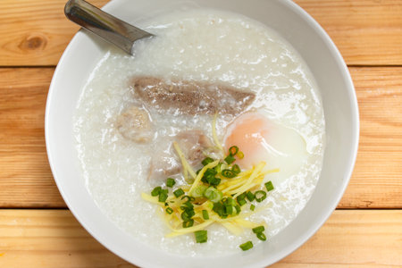 porridge with egg and liver, traditional chinese.の写真素材