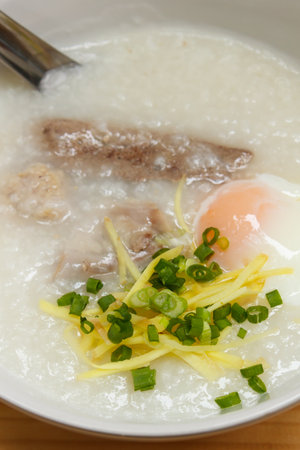 porridge with egg and liver, traditional chinese.の写真素材